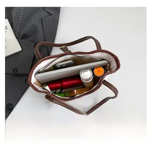 Interior view of large capacity tote bag showing space for tablet and cosmetics