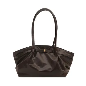 Vintage brown oil wax leather tote bag with glossy finish and long shoulder straps