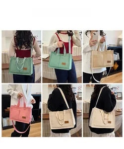 Detail view of large canvas tote bag showing four colors and various carrying styles