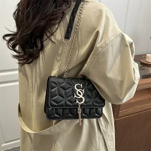 Fashionable black crossbody bag with geometric texture and gold chain strap for women