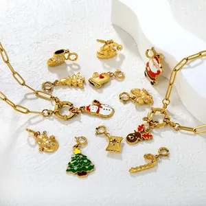 Golden link necklace with colorful enamel Christmas charms including snowman and reindeer
