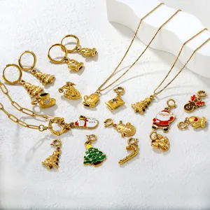 Christmas themed gold alloy jewelry set with colorful enamel pendants and white stand