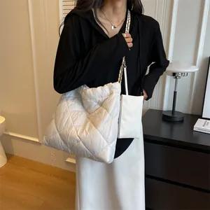 White quilted tote bag with chain strap and matching pouch, minimalist oversized shopper bag