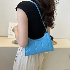 Chic bright blue quilted underarm shoulder bag for women with minimalist urban style