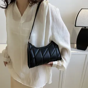 Minimalist black quilted underarm bag for women with elegant crescent shape for daily use