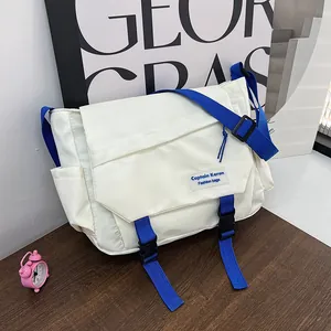 Minimalist blue and white Japanese workwear style crossbody bag with nylon fabric