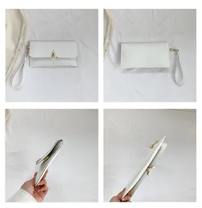 Detailed views of white crocodile pattern envelope clutch bag with gold metal hardware