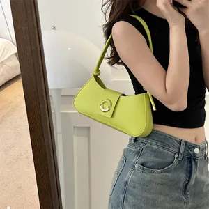 Minimalist bright green leather shoulder bag with knot detail and semi-circle buckle