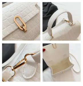 Detail shots of white crocodile-embossed bag with gold hardware and interior structure