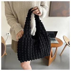 Detail of black popcorn texture tote bag showing unique 3D bubble fabric for casual use