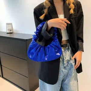 Chic royal blue pleated crescent handbag with glossy finish for trendy women