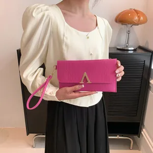 Hot pink faux crocodile leather envelope clutch bag with gold V-shape metal clasp