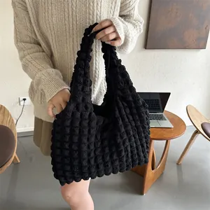 Minimalist black bubble textured tote bag with puffy fabric handle for daily casual wear