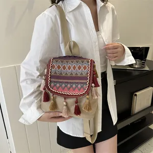 Ethnic bohemian mini backpack with colorful geometric weaving and vibrant tassels