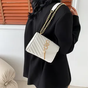 White V-quilted leather crossbody bag with gold metal logo tassel and chain strap