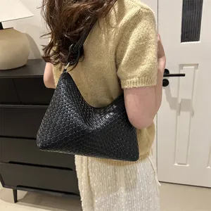 Chic black woven leather hobo shoulder bag for women with minimalist half moon design