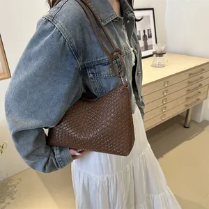 Retro dark brown woven leather hobo bag with a minimalist knot strap for casual wear