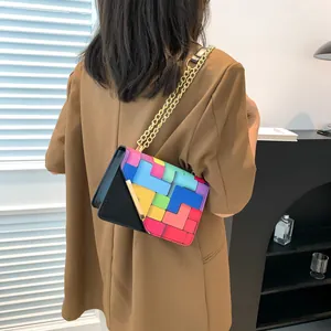 Crossbody square bag with colorful geometric Tetris patterns and gold chain strap
