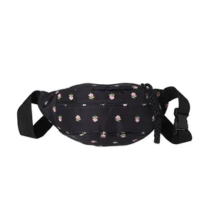 Black waist bag with pink floral print and adjustable strap shown on white background