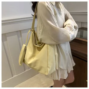 Dettagli della borsa hobo gialla con tracolla regolabile e piccola pochette coordinata