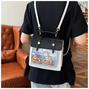 Detailansicht Mini Ita-Bag in Schwarz-Weiß mit Sichtfenster und goldenen Schnallen