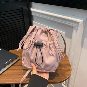 Women's Drawstring Bucket Crossbody Bag Minimalist Nylon Canvas Casual Solid Color Small Shoulder Bag With Adjustable Strap