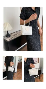 Detail of cream white tote bag with heart-shaped smiley patch and tubular handles