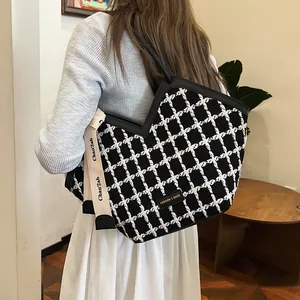 Large capacity black and white checkered tweed tote bag with shoulder strap and leather trim