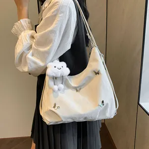 Minimalist white large capacity hobo shoulder bag with silver butterfly and cloud charm