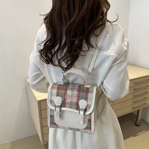 British style checkered backpack in beige with pink bow embroidery and dual metal buckles