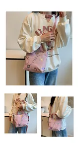 Detailed shot of pink abstract print tote with adjustable shoulder straps and top handles