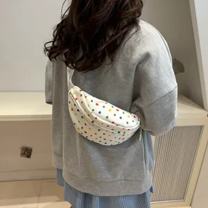 Minimalist white crossbody chest bag with colorful polka dots and adjustable strap