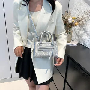 Silver metallic mini square handbag with cracked texture and fringe detail for women