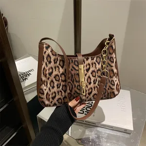 Leopard print underarm bag with faux leather trim and gold metal buckle for women
