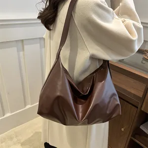 Chic dark brown faux leather tote bag with soft slouchy texture for everyday commute