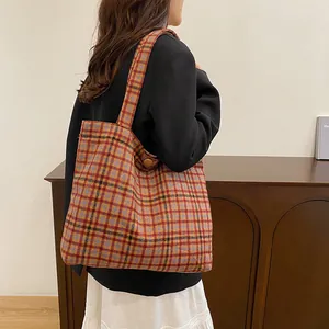 Winter plaid tote bag with colorful Scottish pattern and wide shoulder strap