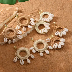 Bohemian woven raffia hoop earrings with natural seashells for beach vacation style