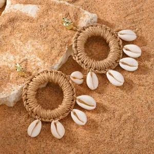 Bohemian woven raffia earrings with gold metal plate and natural sea shell charms