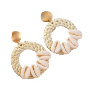 Bohemian woven rattan hoop earrings with gold metal studs and natural shell pendants