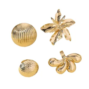 Polished gold plated geometric ring set with vertical stripe and floral textured designs