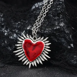 Gothic vintage silver necklace with a radiant red enamel heart pendant on black mesh