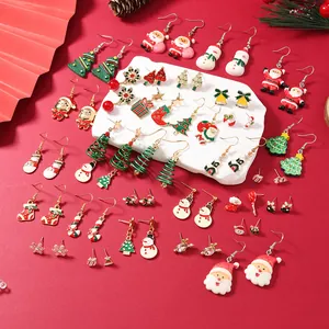 Christmas earrings set featuring enamel Santa, reindeer, and snowflakes on red background