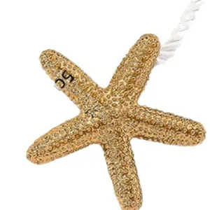 Golden starfish pendant necklace with textured surface and sun-inspired marine style charm