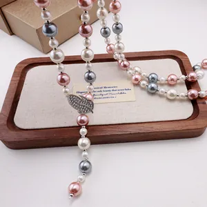 Elegant pearl sweater necklace with silver leaf pendant and zircon accents for women