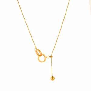 Elegant gold tassel necklace with double interlocking rings and adjustable slider chain