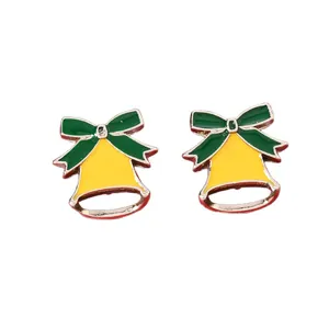 Christmas bell stud earrings featuring yellow enamel finish and green festive bow tie decor