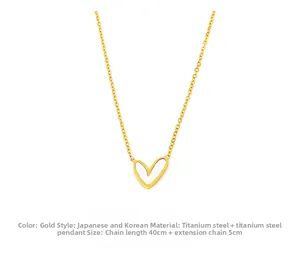 Detail of heart pendant necklace in gold titanium steel with 40cm adjustable chain