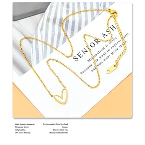 Detail of 18k gold plated titanium necklace featuring heart pendant and lobster clasp