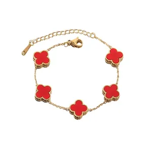Titanium steel gold bracelet featuring five red clover charms and adjustable lobster clasp
