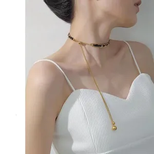 Elegant leather woven gold chain necklace with long tassel pendant and golden beads